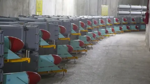 Reuters Missiles sit on trailers inside a concrete bunker.