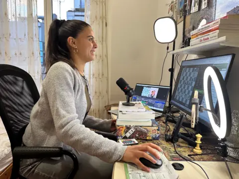 Sarah El Barbry streaming from her room in Paris.